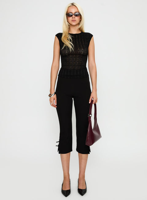 back view of model wearing Princess Polly Keep It Moving Top Black Sleeveless Crew Neck 