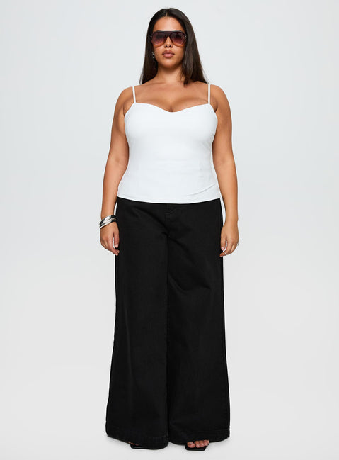 side view of model wearing Princess Polly Goldie High Rise Wide Leg Jeans True Black Curve High Rise Jeans Jeans 