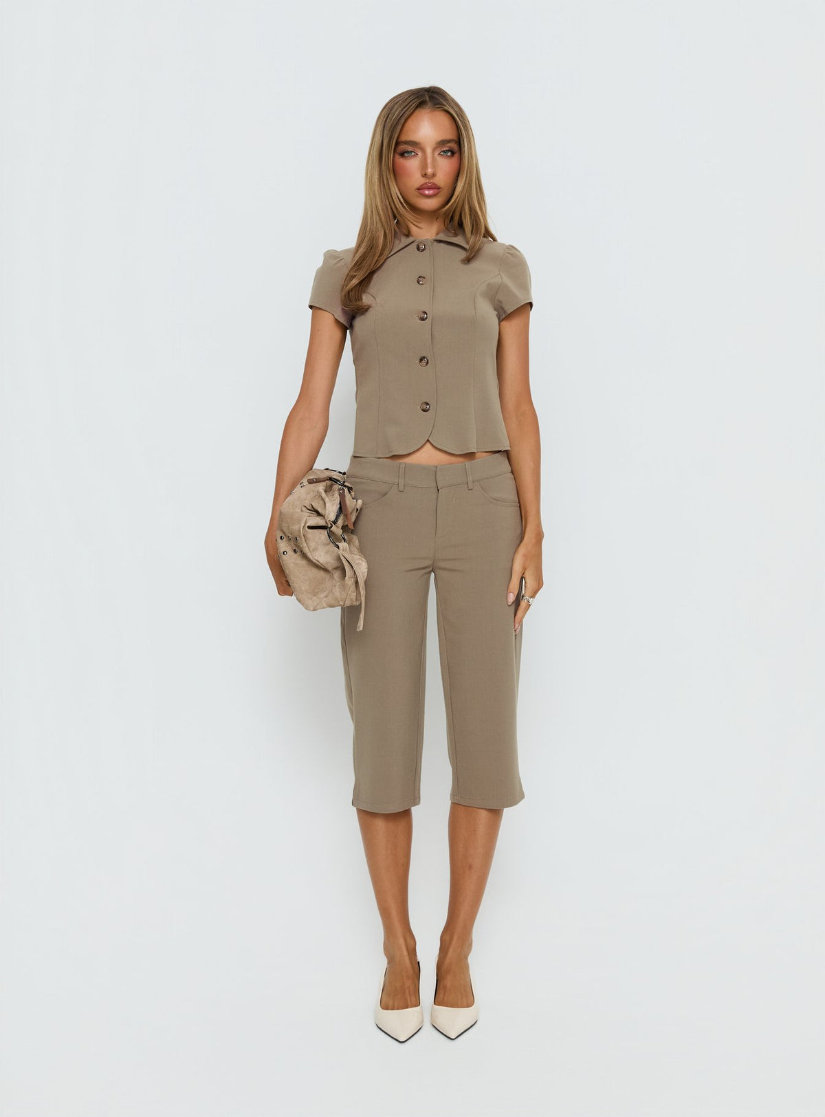 front view of model wearing Princess Polly Tunian Capri Tailored Pants Taupe Mid Rise Pants Pants 