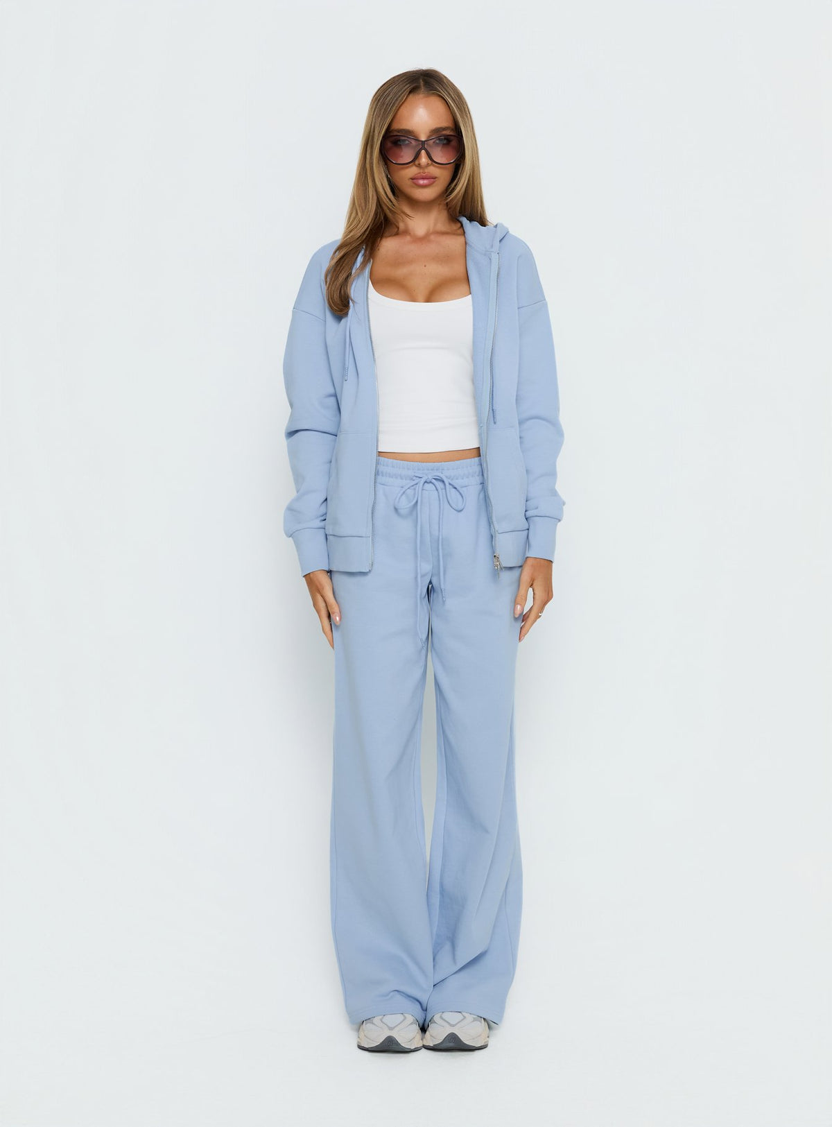 side view of model wearing Princess Polly All Day Oversized Hoodie Icy Blue regular Jumpers 