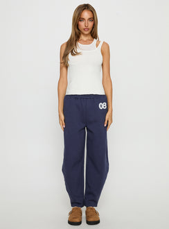 front view of model wearing Princess Polly Route 08 Barrel Track Pant Navy Mid Rise Pants Pants 