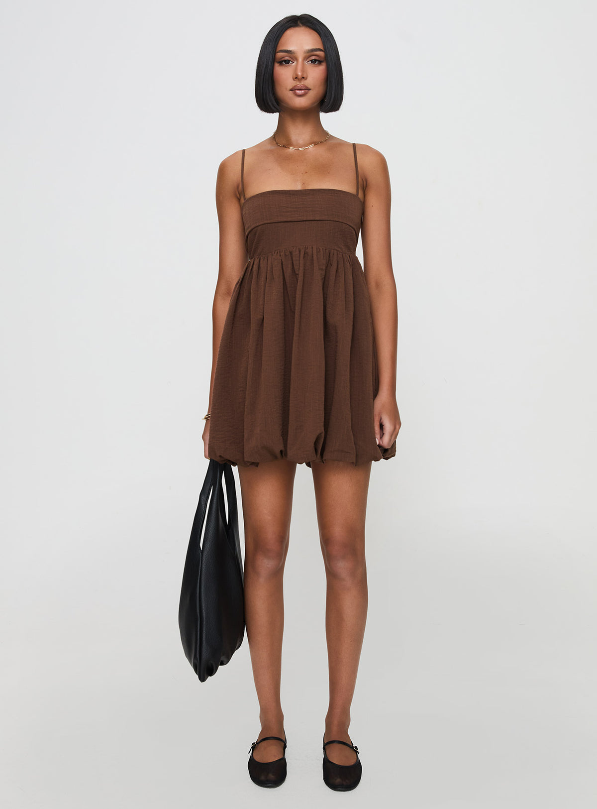 front view of model wearing Princess Polly Layken Bubble Hem Mini Dress Chocolate Petite Square Neck 