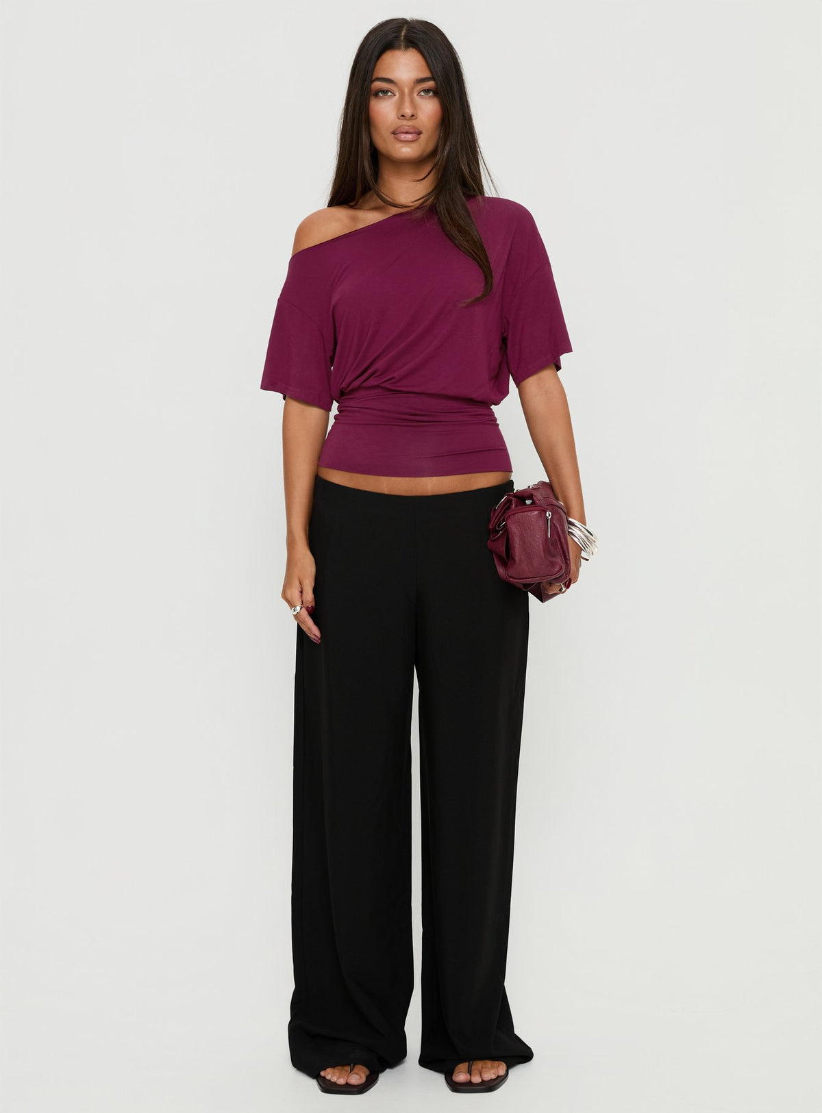 Featuring the Khane Low Rise Wide Leg Pant Black Tall in womens-regular-pants with low-rise waist front view of model wearing Princess Polly
