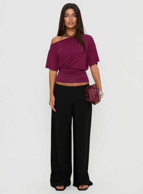 Crafted from the Khane Low Rise Wide Leg Pant Black Petite in womens-regular-pants detail view of model wearing