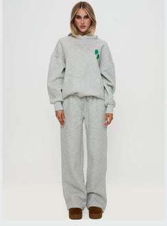 side view of model wearing Princess Polly Princess Polly Hooded Sweatshirt Bubble Text Grey Marle / Green Jumpers 