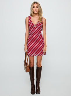 side view of model wearing Princess Polly Nadiah Mini Dress Red Stripe V-Neck 