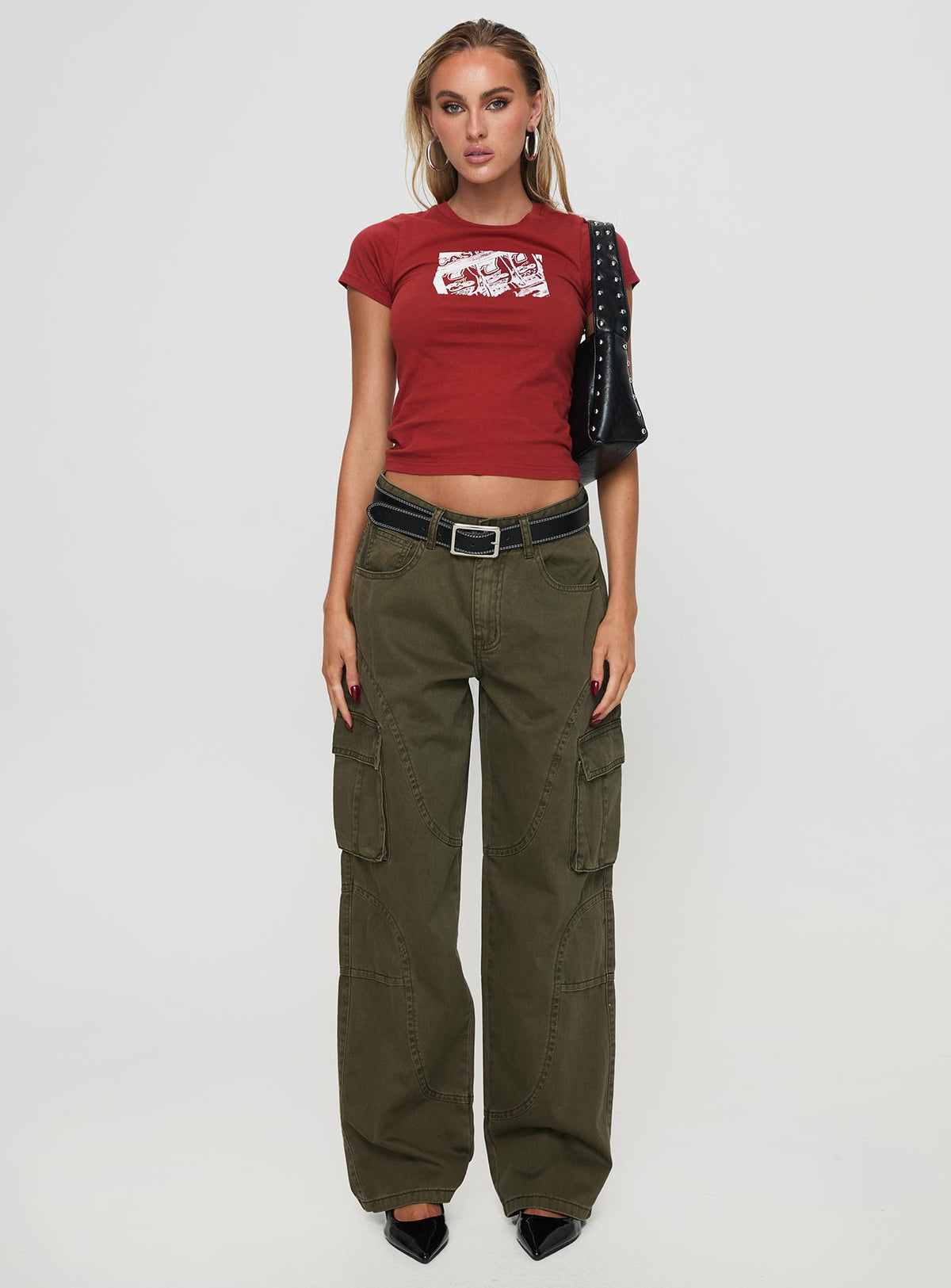 side view of model wearing Princess Polly Ahstin Cargo Jeans Green Low Rise Jeans 