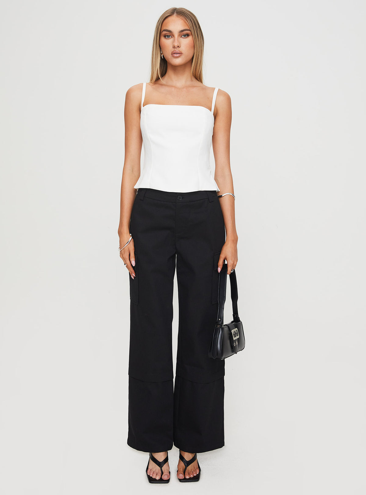 front view of model wearing Princess Polly Raider Low Waist Cargo Pant Black High Rise Pants Pants 