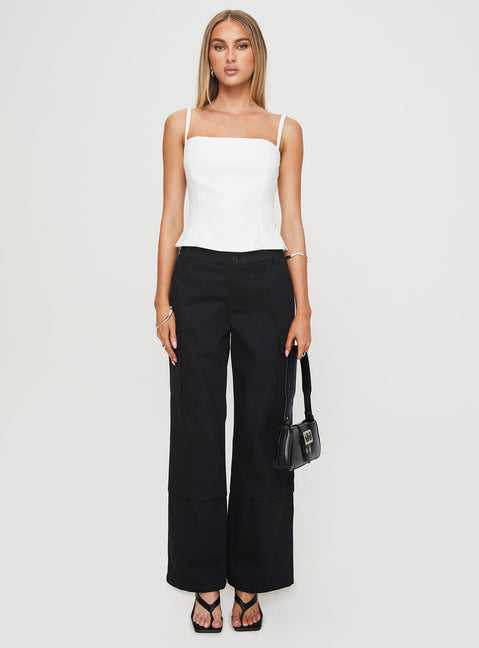 front view of model wearing Princess Polly Raider Low Waist Cargo Pant Black High Rise Pants Pants 