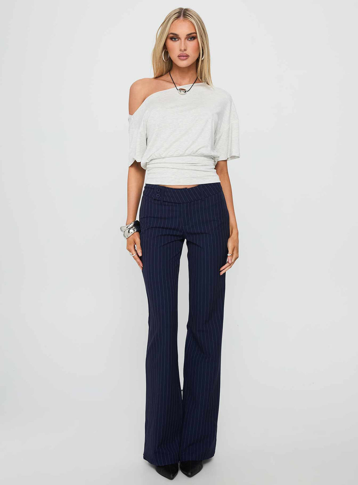 front view of model wearing Princess Polly Kinkirk Flared Pants Navy Pinstripe Low Rise Pants Pants 