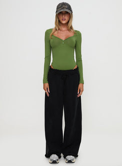 side view of model wearing Princess Polly Delgado Long Sleeve Bodysuit Olive Long Sleeve Tops Bodysuit 