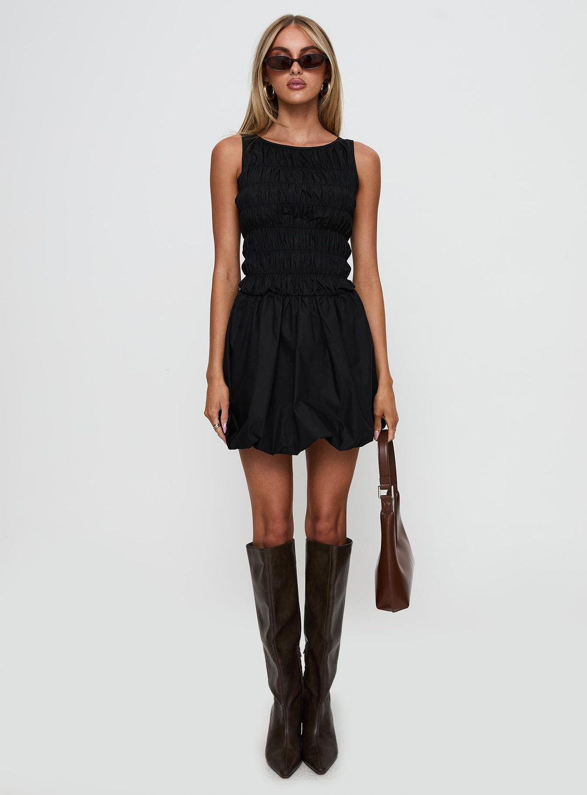 front view of model wearing Princess Polly Demure Shirred Bubble Hem Mini Dress Black Scoop Neck 