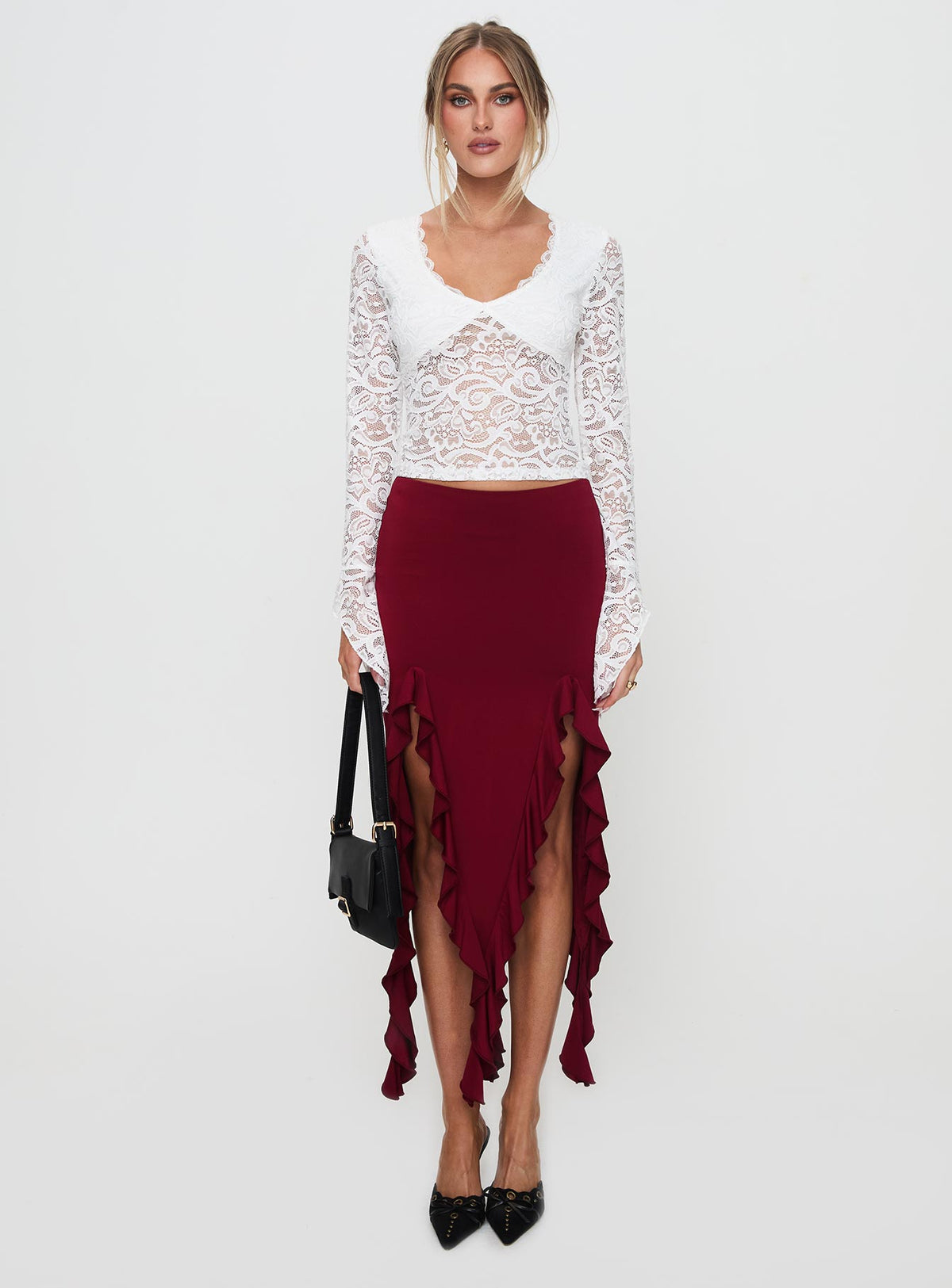   side view of model wearing Princess Polly Peachey Asymmetric Ruffle Midi Skirt Burgundy Midi Skirts Skirts 