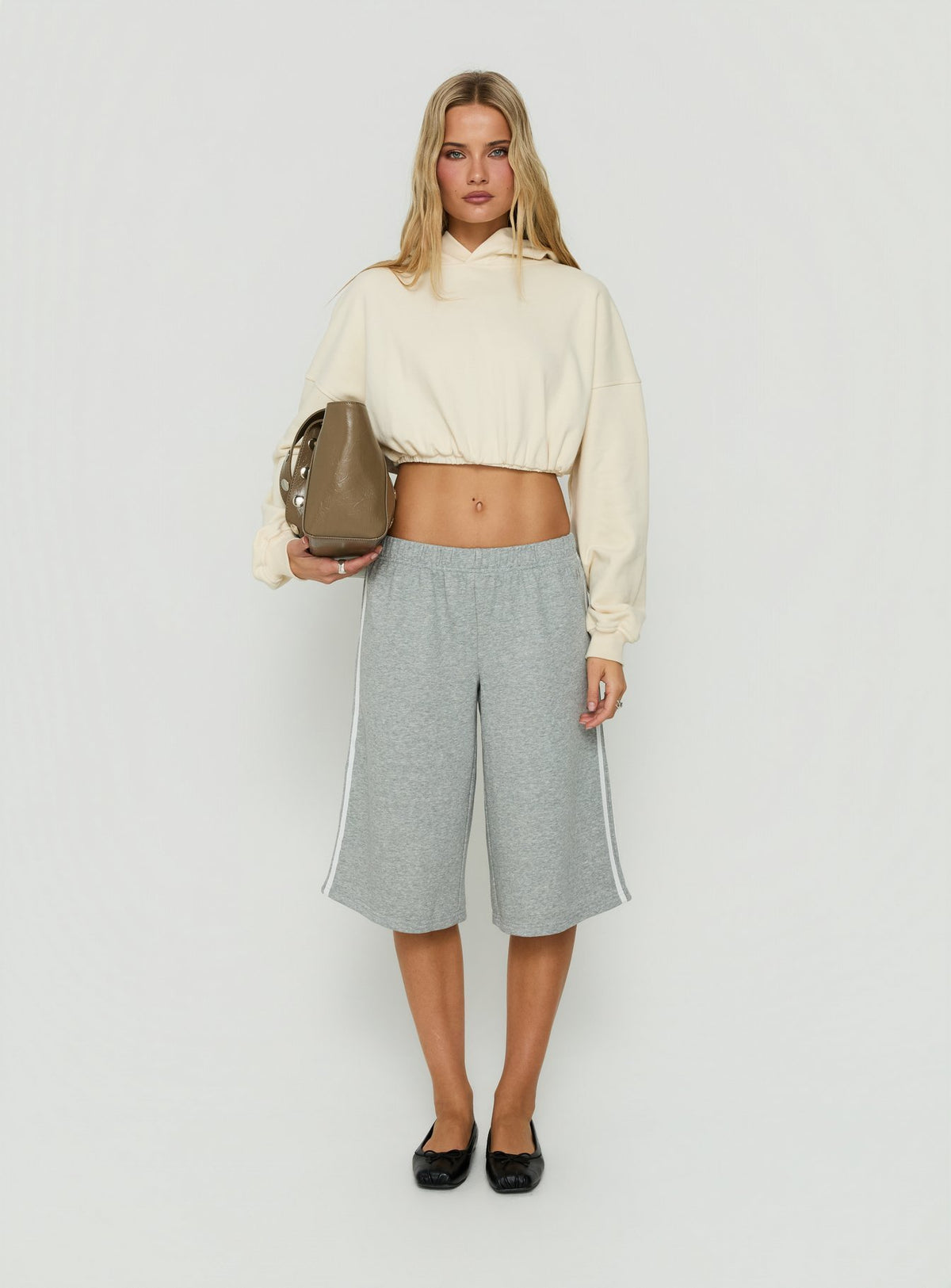 Featuring the Mayse Bubble Hem Cropped Hoodie Cream womens jumpers in short length front view of model wearing Princess Polly