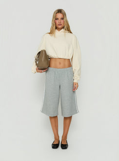 Featuring the Mayse Bubble Hem Cropped Hoodie Cream womens jumpers in short length front view of model wearing Princess Polly