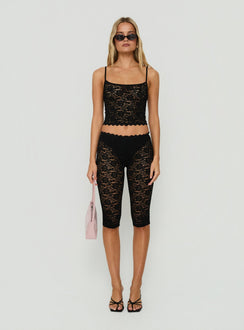 Showcasing the Torrin Lace Capri Pants Black womens-regular-pants with high-rise front view of model wearing Princess Polly