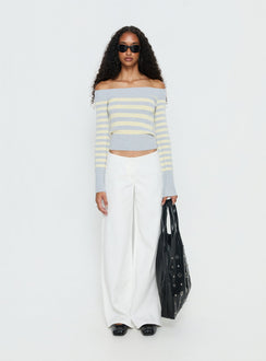 side view of model wearing Princess Polly Hereos Mid Rise Baggy Leg Jeans White Mid Rise Jeans Jeans 