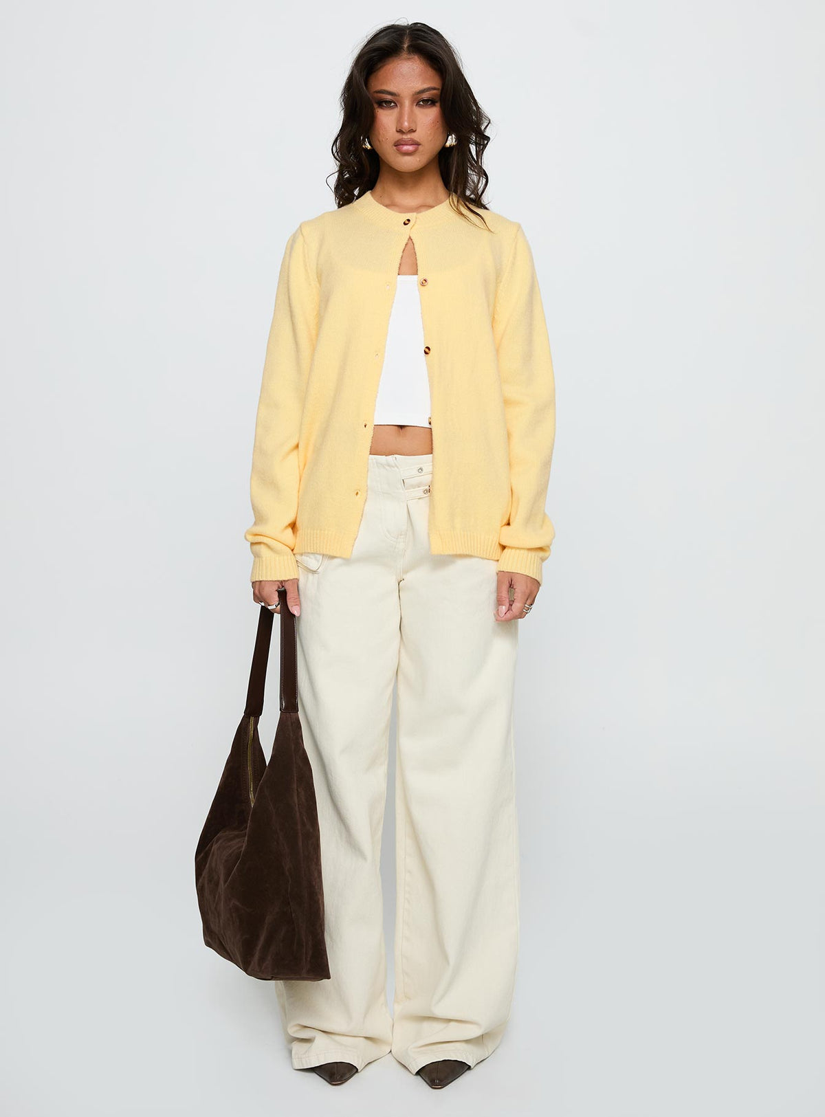side view of model wearing Princess Polly Arica Button Up Knit Cardigan Lemon Longline Jumpers Jumpers 