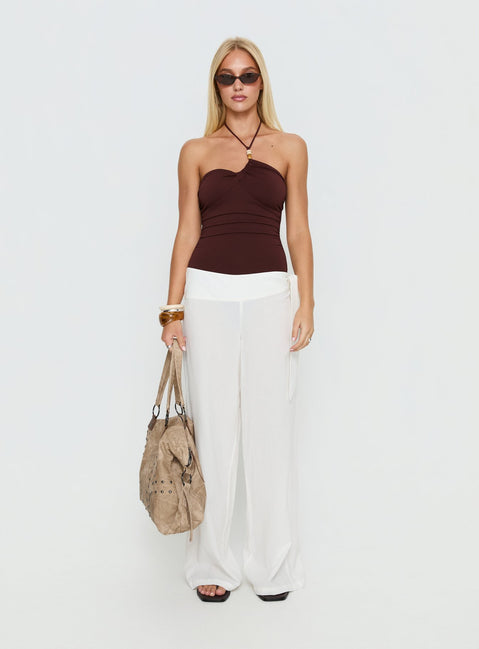side view of model wearing Princess Polly Meda Bead Detail Ruched Bodysuit Brown Sleeveless Bodysuit 