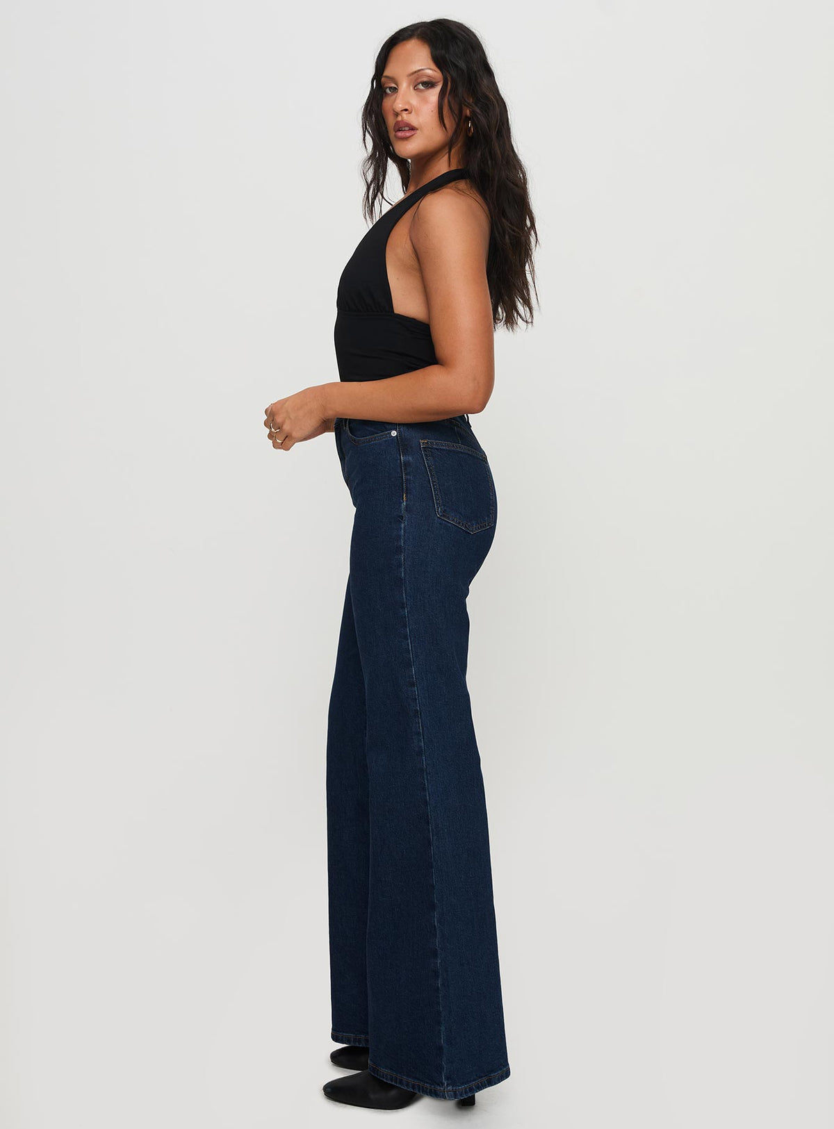 side view of model wearing Princess Polly Thearlie High Flare Jean Dark Wash High Waisted 