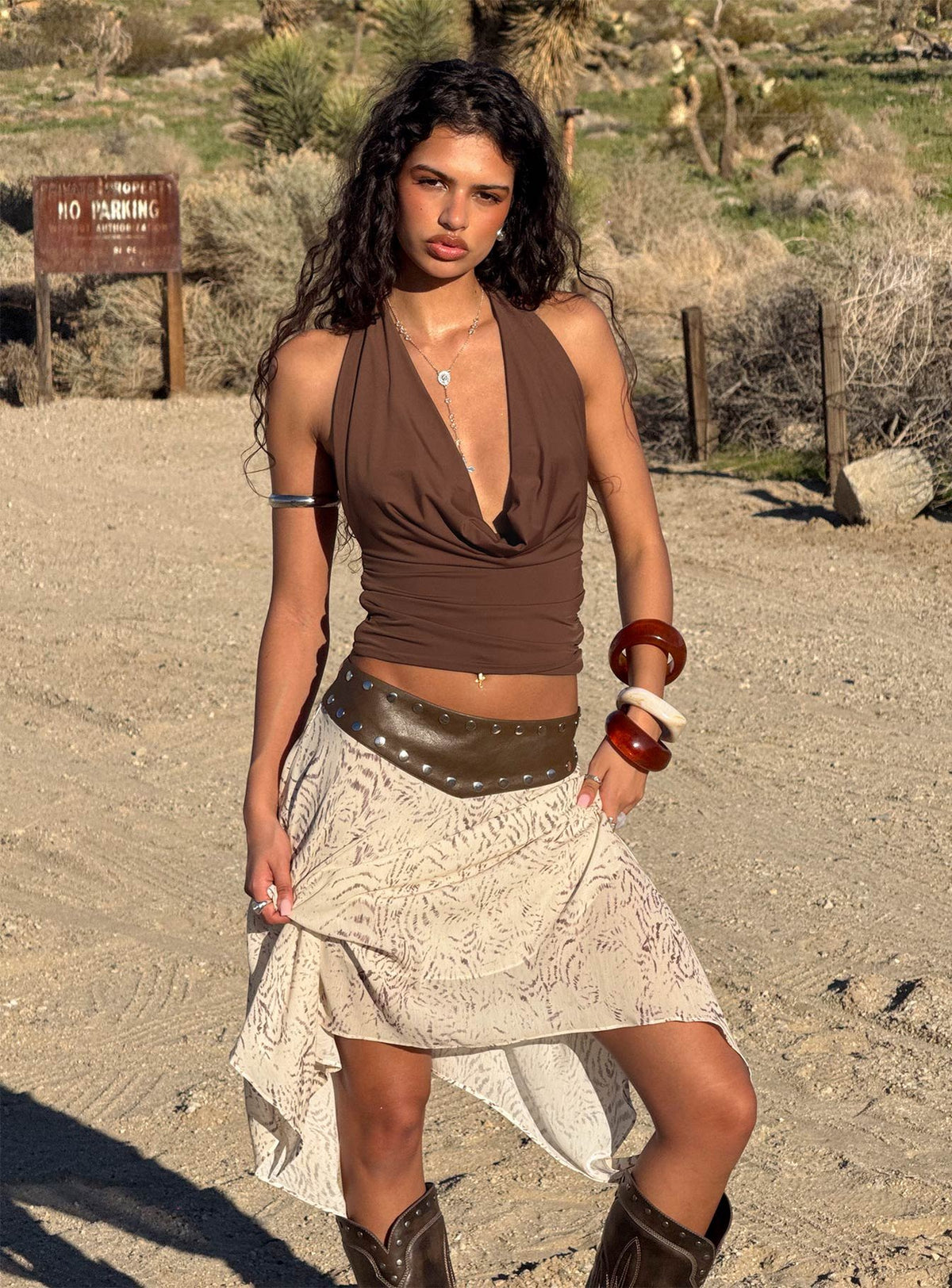 Showcasing the Dark Mirage Asymmetrical Midi Skirt Multi in abstract print with relaxed fit front view of model wearing Princess Polly