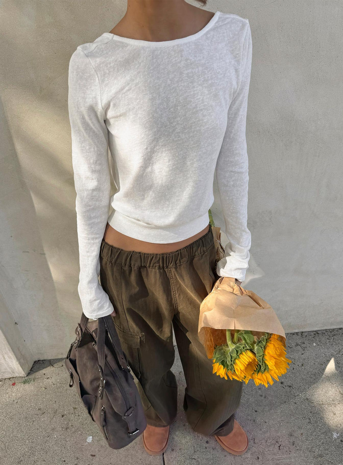 Showcasing the Scarletta Ultra Wide Elasticated Waist Cargo Pants Khaki in womens regular pants with high-rise front view of model wearing Princess Polly