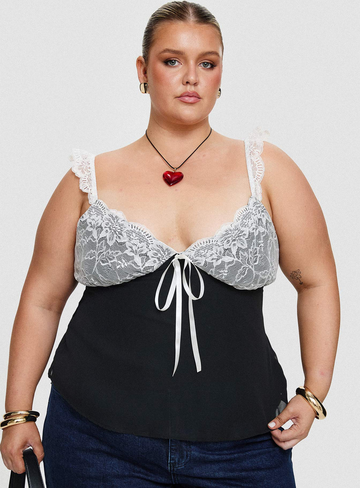 front view of model wearing Princess Polly Delvonte Top Black Curve Sleeveless Plunger 