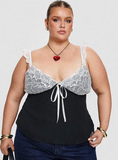 front view of model wearing Princess Polly Delvonte Top Black Curve Sleeveless Plunger 