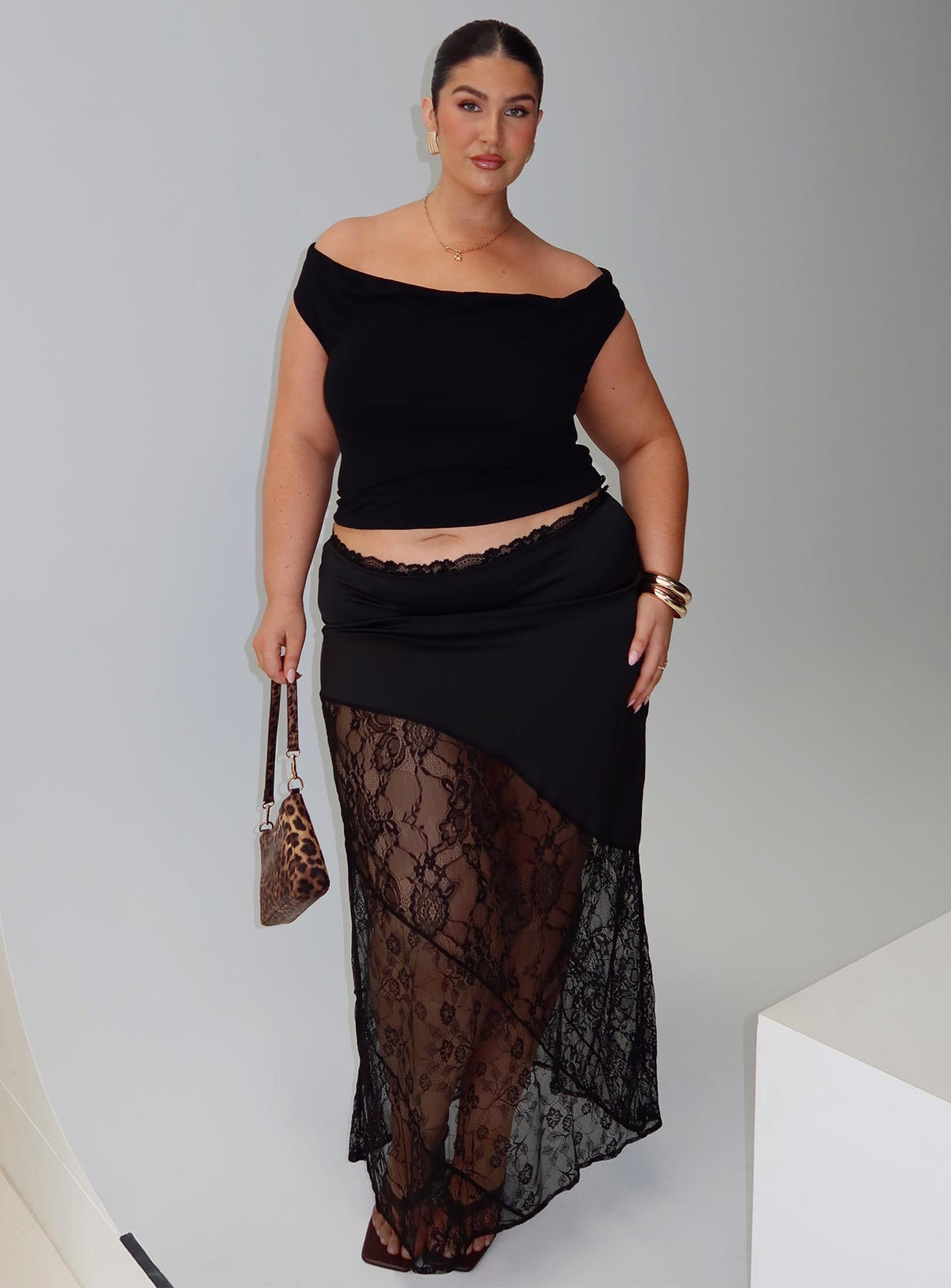 side view of model wearing Princess Polly Irina Multi-wear Top Black Curve Short Sleeves straight 