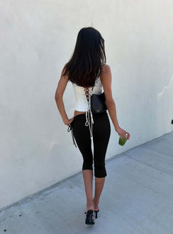 Presenting the Bailor Channel Waistband Capri Pants Black in womens-regular-pants with high-rise and ruched slim design back view of model wearing Princess Polly