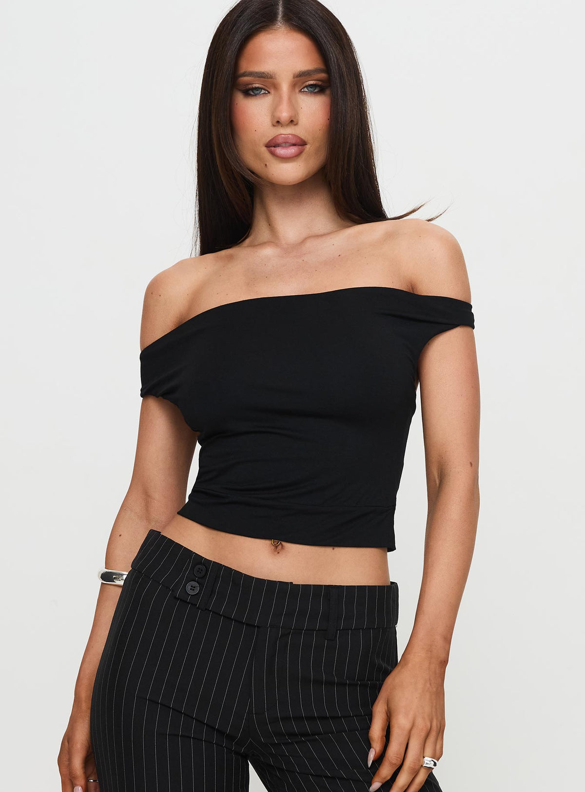 front view of model wearing Princess Polly Irina Multi-Wear Top Black Sleeveless Asymmetric Neckline 