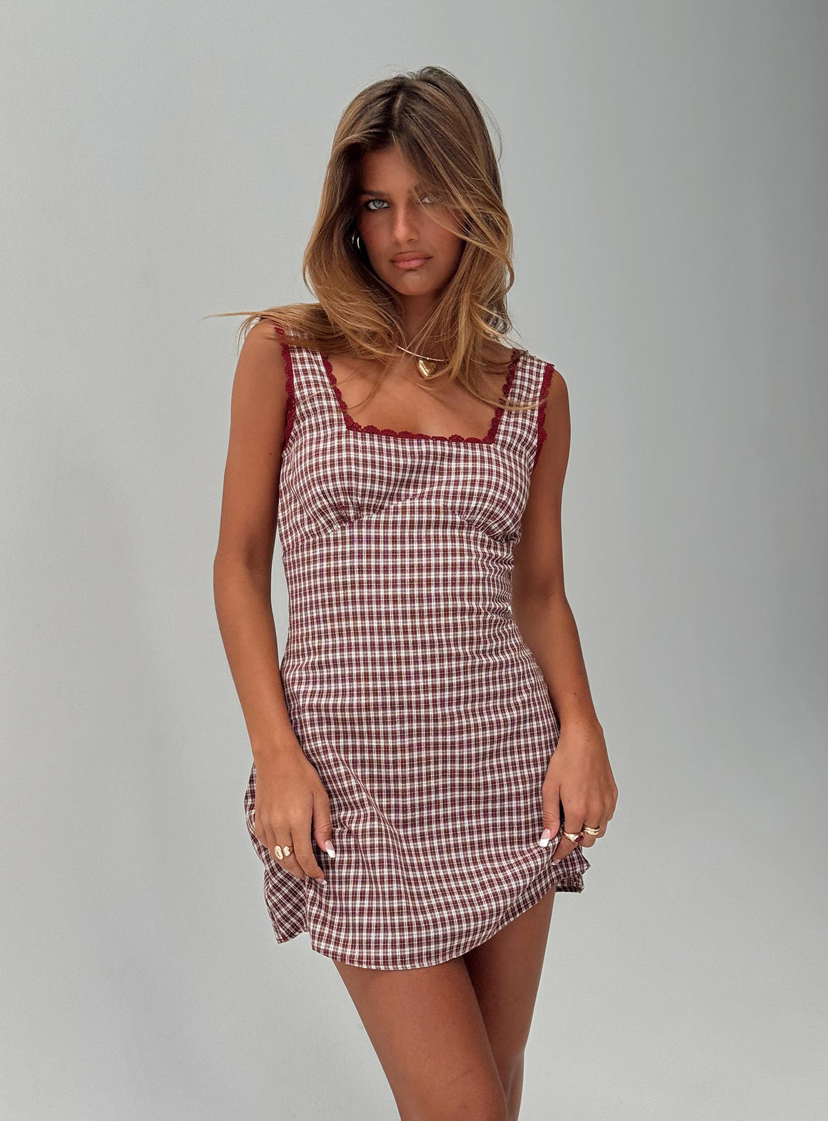 side view of model wearing Princess Polly Dasha Mini Dress Red Check Square Neck 