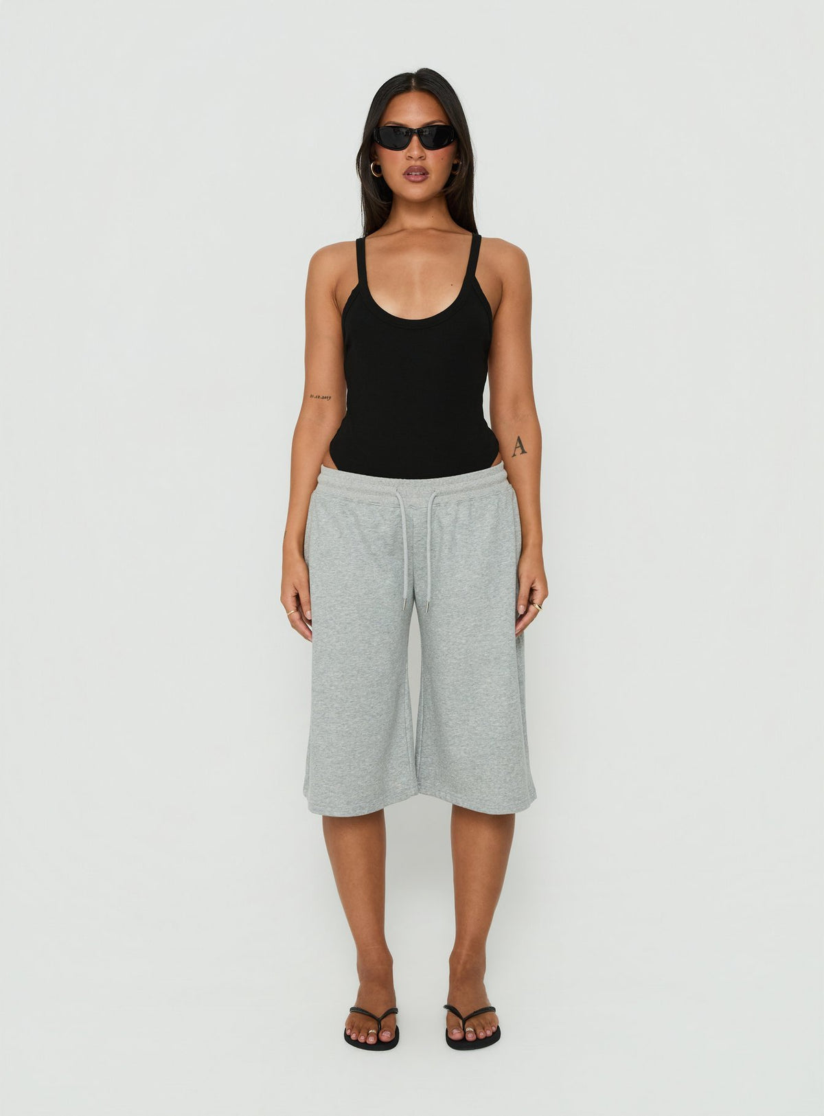 Introducing the Nerinah Ribbed Bodysuit in Black womens-bodysuit with sleeveless styling front view of model wearing