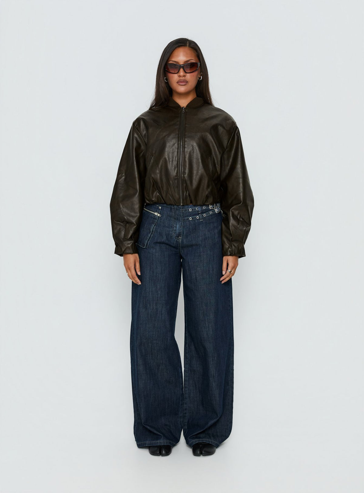 front view of model wearing Princess Polly Paltrow Mid Rise Wide Leg Cargo Jeans Dark Blue Wash Mid Rise Jeans Jeans 