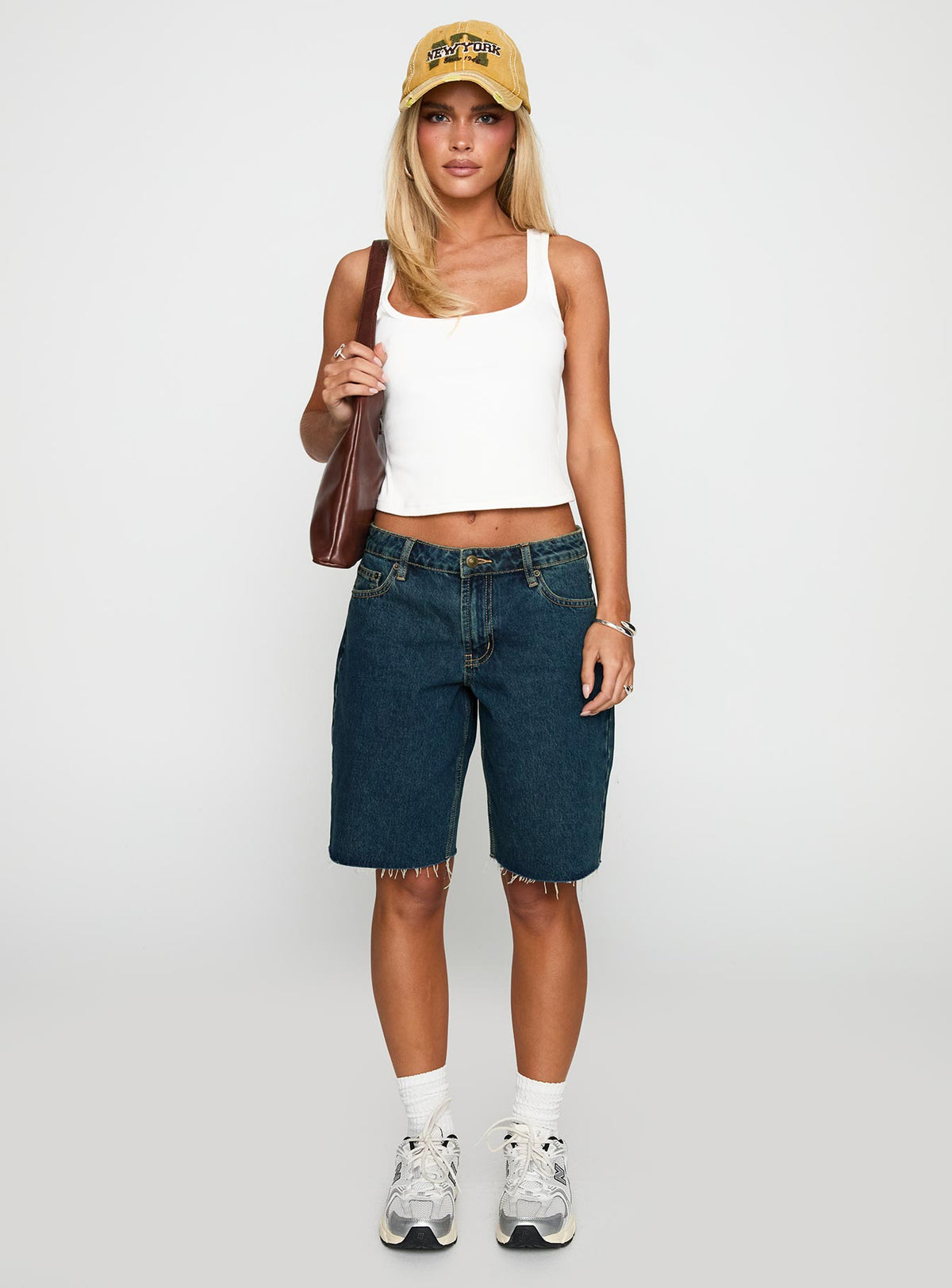 side view of model wearing Princess Polly Cult Classic Longline Denim Shorts Vintage Wash Low Rise Shorts 