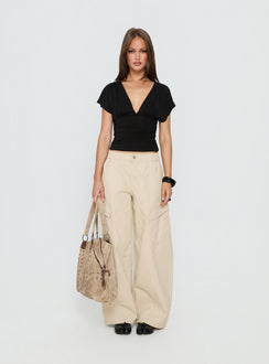 front view of model wearing Princess Polly Selective Memory Low Rise Wide Leg Cargo Pants Cream Low Rise Pants Pants 