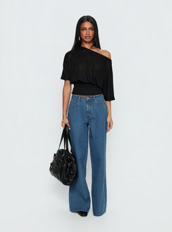 side view of model wearing Princess Polly Naylor Mid Rise Wide Leg Jeans Mid Blue Wash Mid Rise Jeans Jeans 