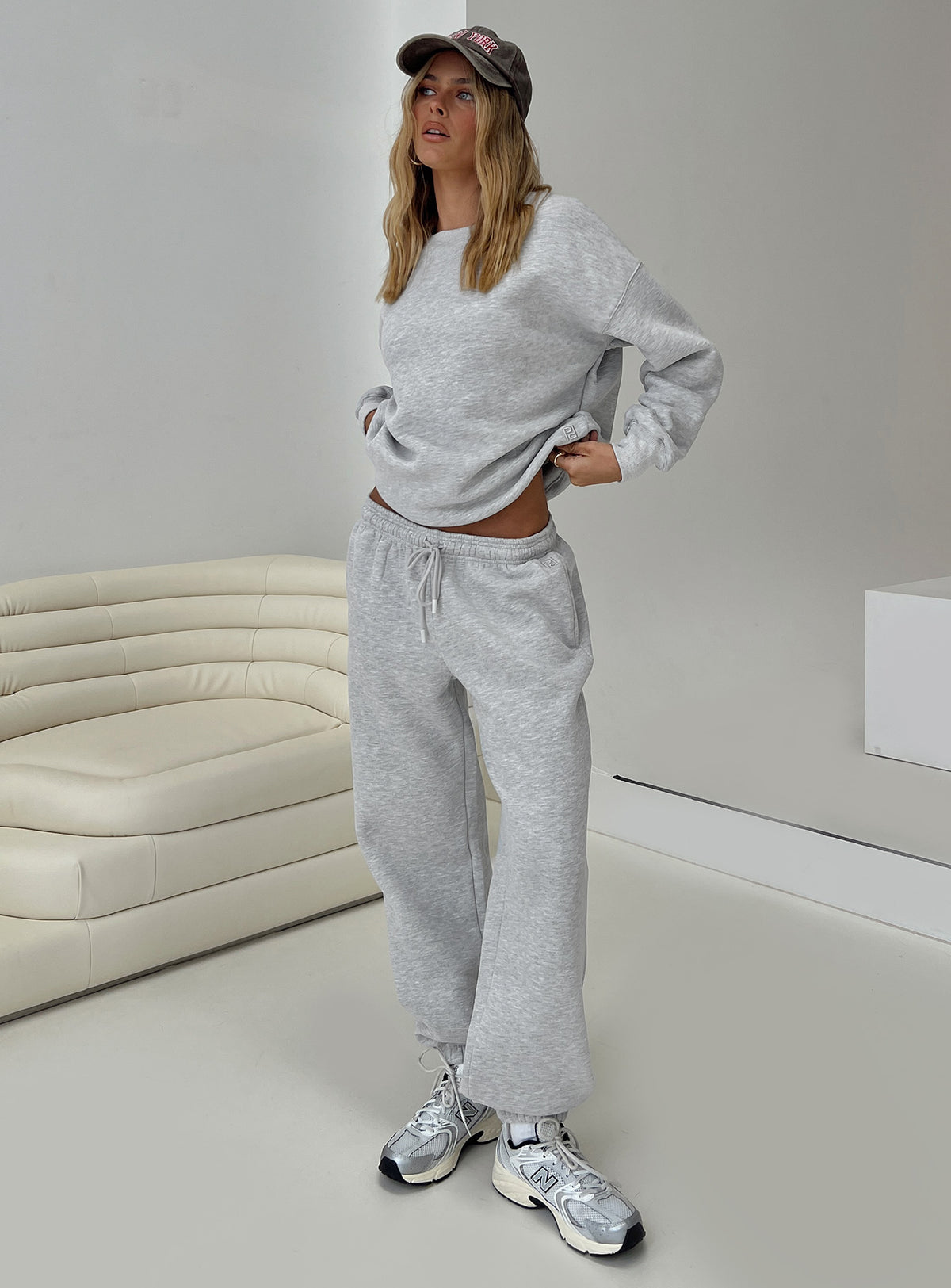 side view of model wearing Princess Polly Dream Fleece Ankle Cuff Sweatpants Grey Marle High Waisted Pants 