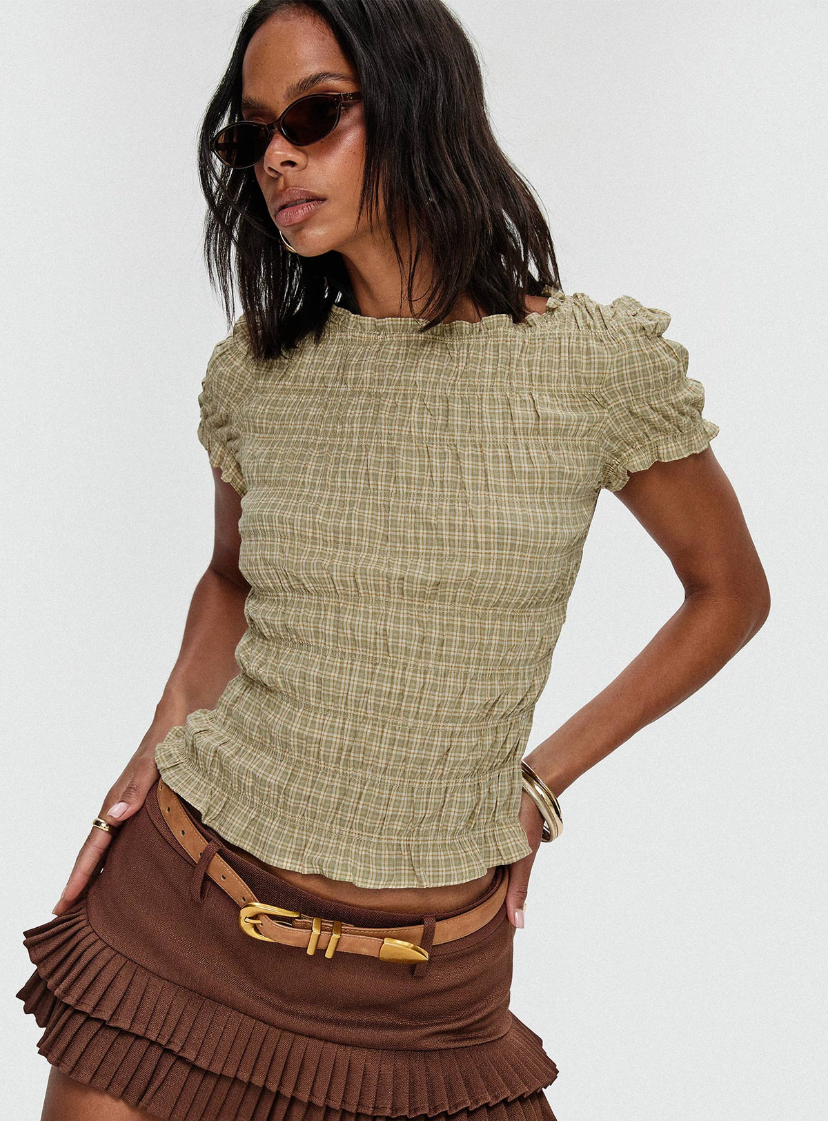 side view of model wearing Princess Polly Deei Double Ruffle Mini Skort Chocolate Low Rise Shorts 