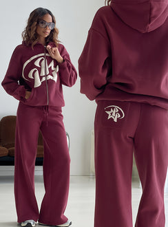 Highlighting the Stargirl Zip Through Jumper in Burgundy womens jumpers with long fit showcasing graphic detail Princess Polly