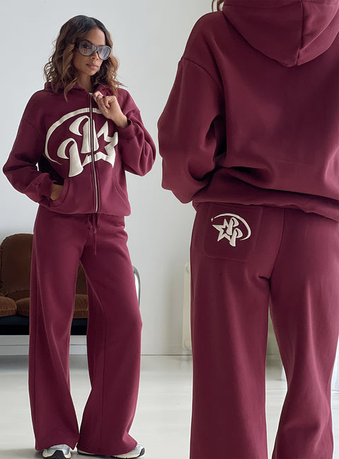 Highlighting the Stargirl Zip Through Jumper in Burgundy womens jumpers with long fit showcasing graphic detail Princess Polly