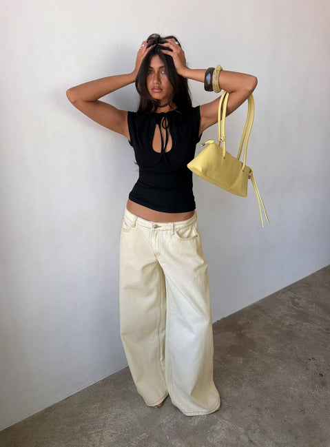 Discover the Ramos Low Rise Wide Leg Jeans in Cream front view of model wearing
