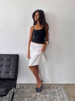 Presenting the Evangela Sheer Midi Skirt White Polka Dot womens-skirts in midi length side view of model wearing Princess Polly
