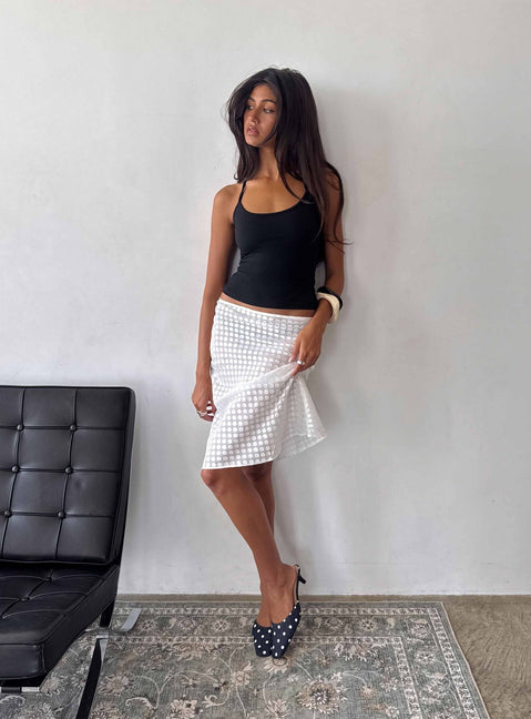 Presenting the Evangela Sheer Midi Skirt White Polka Dot womens-skirts in midi length side view of model wearing Princess Polly