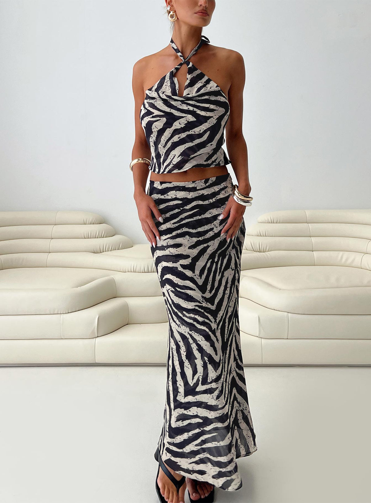 back view of model wearing Princess Polly Eleganza Top Zebra Sleeveless Cowl 