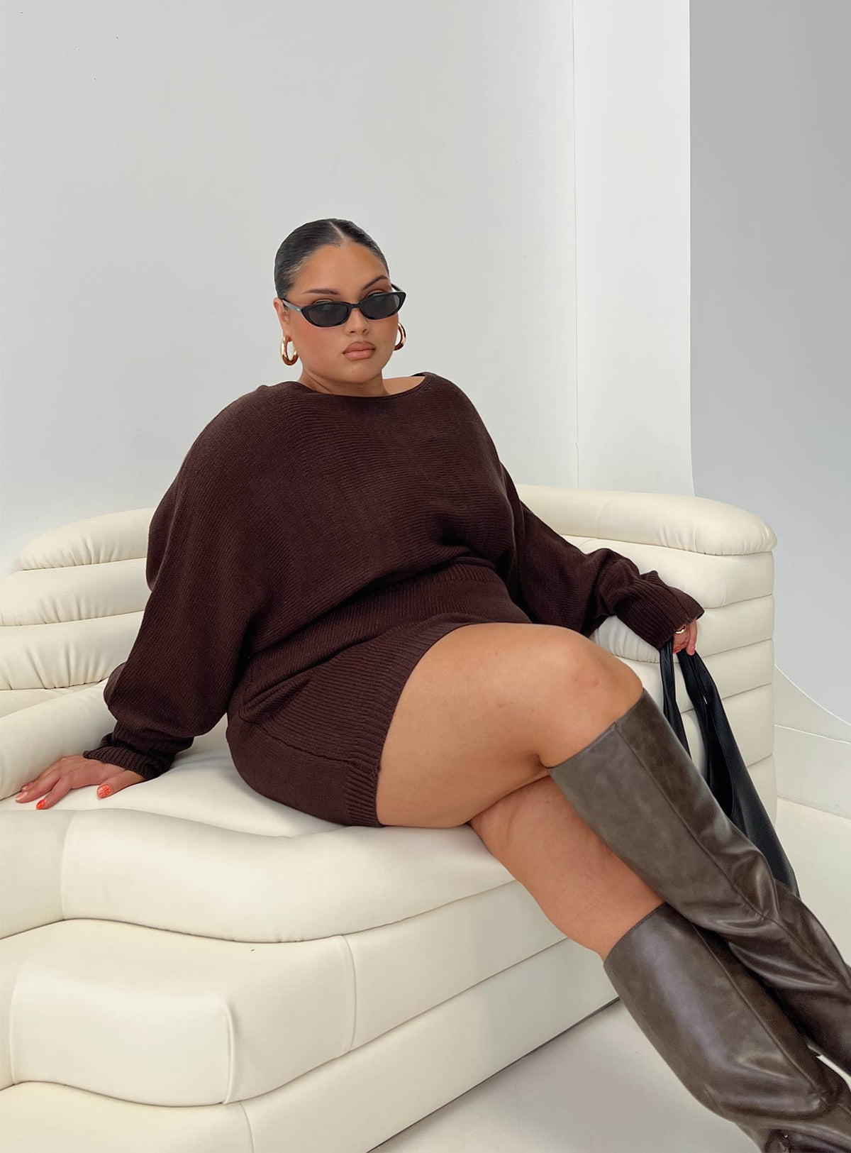 side view of model wearing Princess Polly Bellamie Long Sleeve Mini Dress Chocolate Curve Boat Neck 