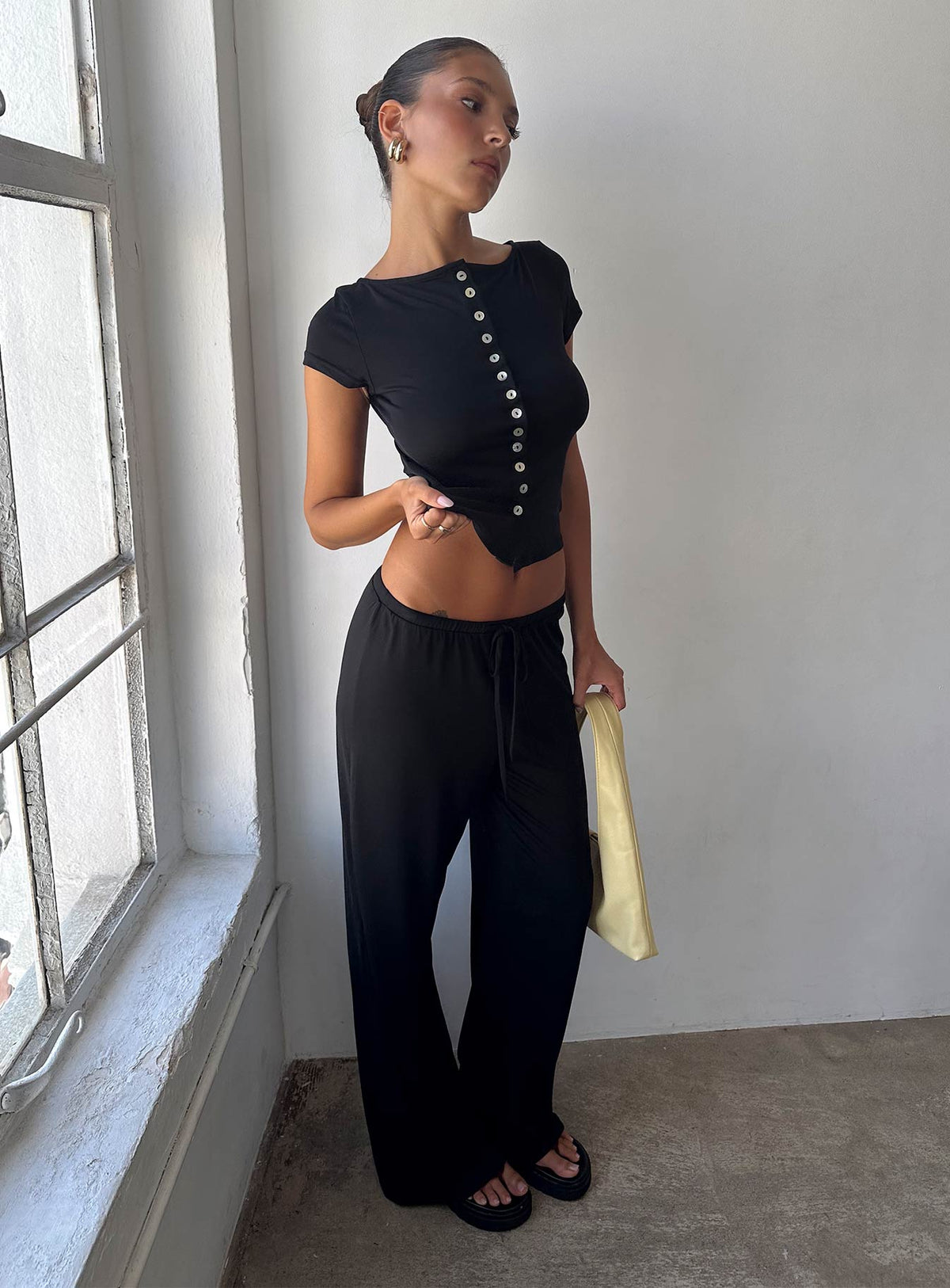 front view of model wearing Princess Polly Gavrielle Jersey Wide Leg Pants Black High Rise Pants Pants 