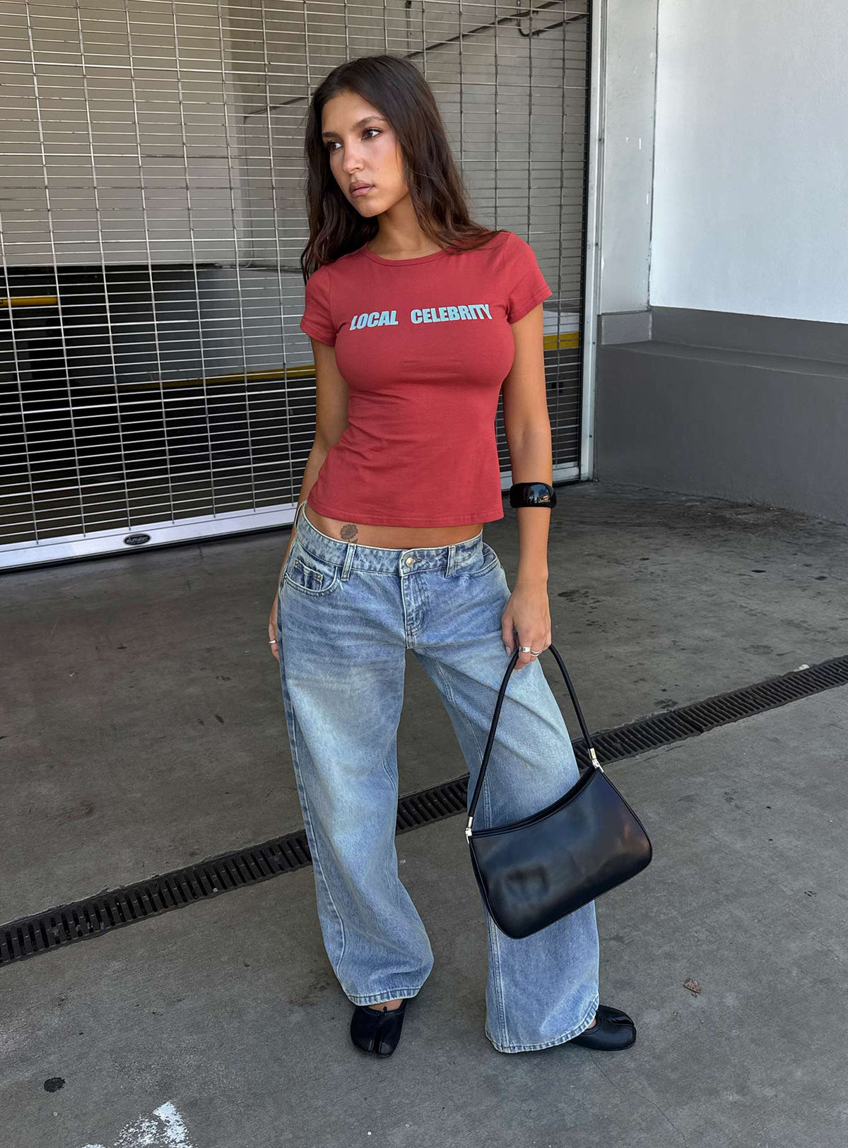 Showcasing Ellanor Low Rise Slouch Denim Jean Washed Mid Blue womens-jeans front view of model wearing Princess Polly