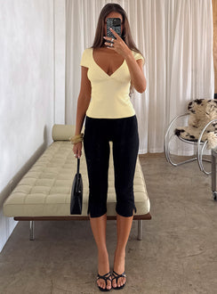 front view of model wearing Princess Polly Baseline Rib Capri Pants Black Tall Mid Rise Pants Pants 