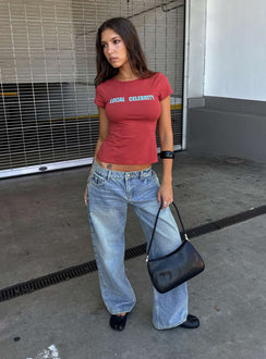 Showcasing the Ellanor Low Rise Slouch Denim Jean Washed Mid Blue Wash Tall womens-jeans front view of model wearing Princess Polly